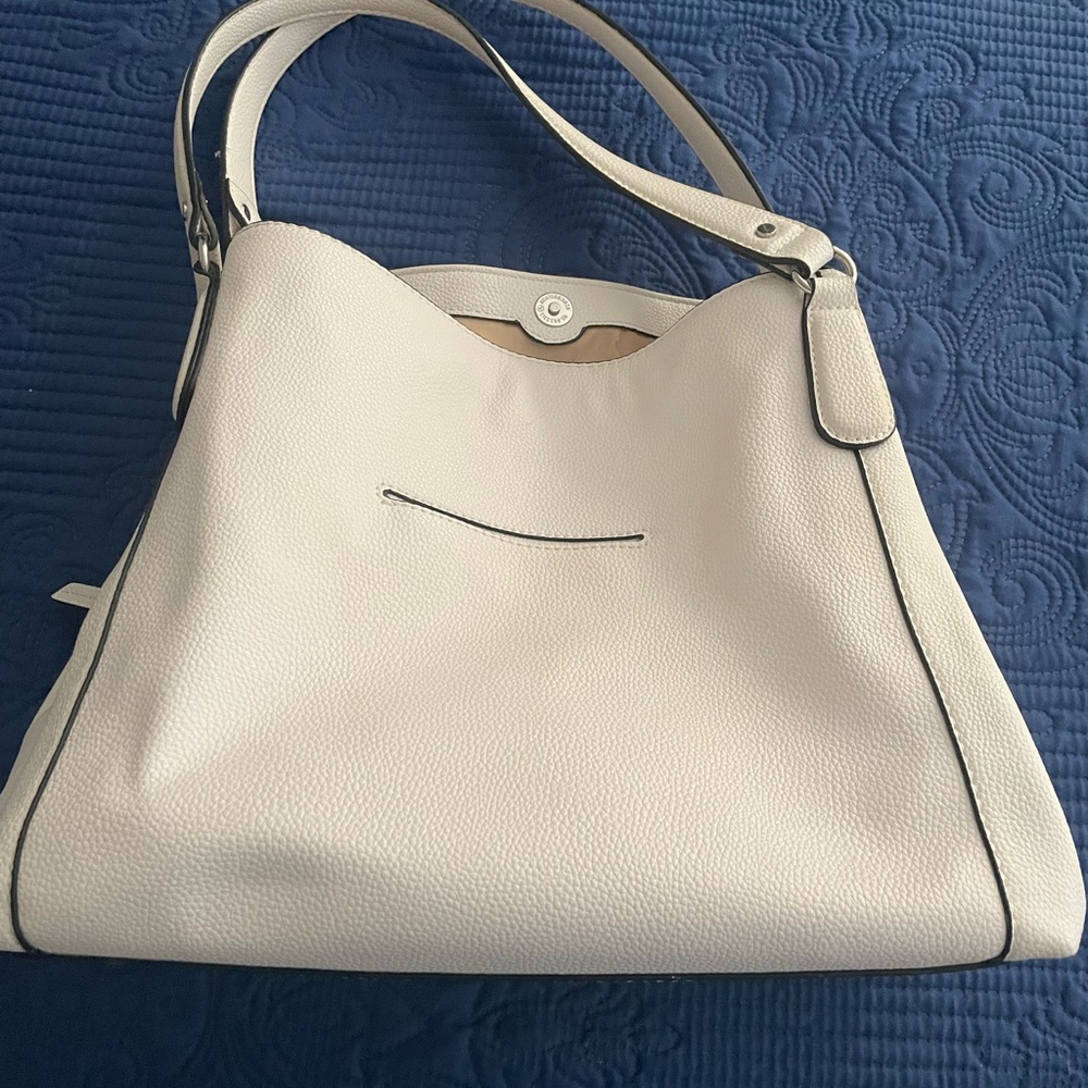 Like new Dana Buchman designer white bag. Multiple compartments and phone pocket